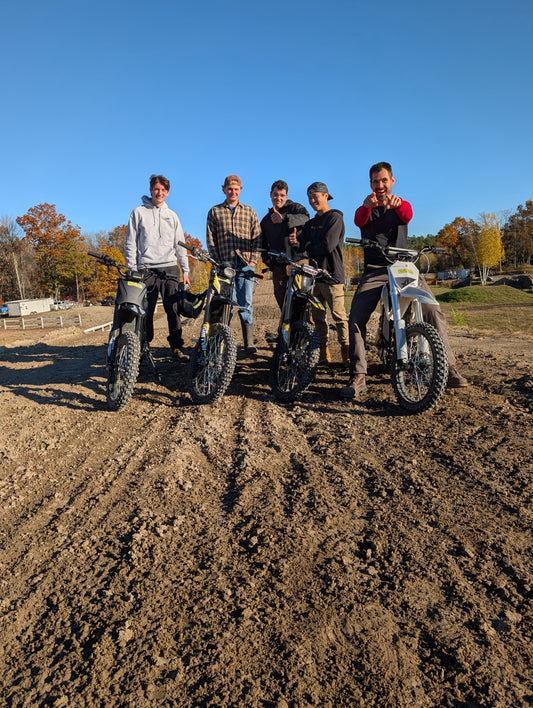 Radmoto team with electric dirt bikes at MX207 during the October 2026 team outing
